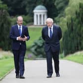 Prime Minister Boris Johnson (right) and Taoiseach Micheal Martin walking in the gardens of Hillsborough Castle during the Prime Minister's visit to Belfast on Thursday. Mr Johnson talked about the government's intention to mark Northern Ireland's centenary. Photo: Brian Lawless/PA Wire
