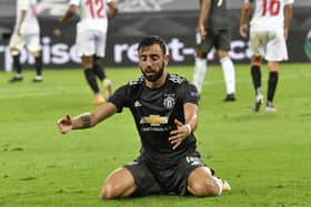 Manchester United's Bruno Fernandes kneels on the ground at the end of an Europa League semi-final loss to Sevilla. Pic by AP.
