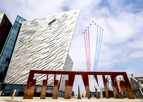 The Red Arrows pass over the Titanic visitor centre in Belfast, Northern Ireland as part of Victory in Japan (VJ) Day 75h anniversary celebrations to mark the end of the Second World War. Pic by Steven McAuley