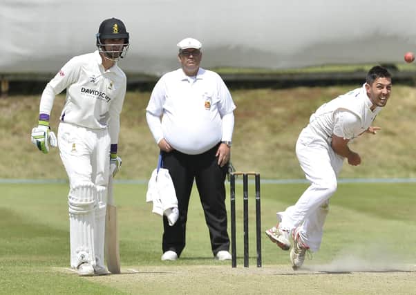 Ruhan Pretorious bowling for North Down.
