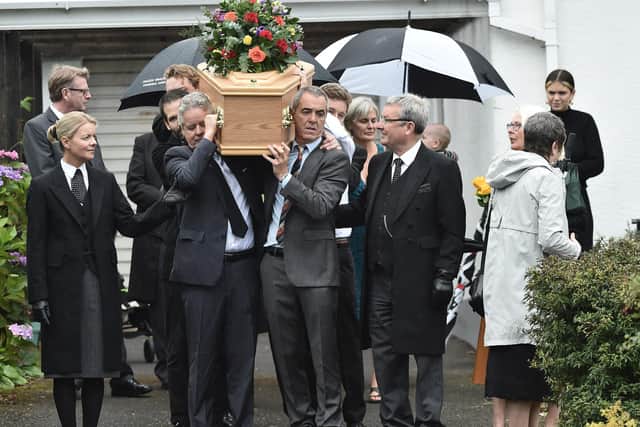Actor James Nesbitt among those carrying the coffin of his dad father Jim outside the family home in Castlerock on Monday.

Photo Colm Lenaghan/Pacemaker Press