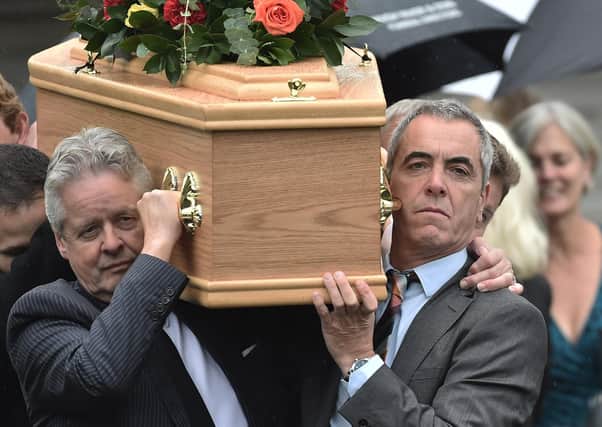 Actor James Nesbitt  carrying the coffin for his father Jim outside the family home in Castlerock on Monday.

Photo Colm Lenaghan/Pacemaker Press