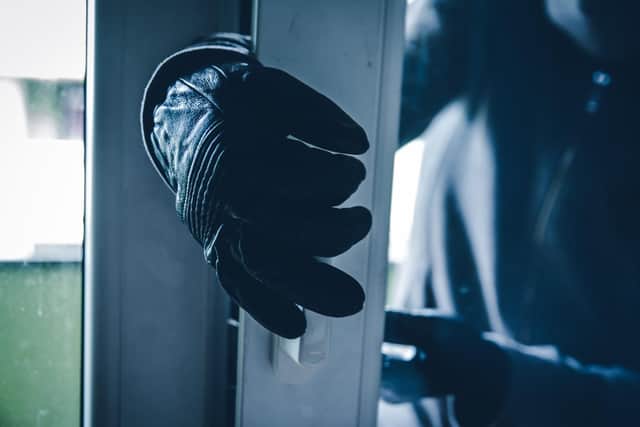 Burglar Breaking Into House