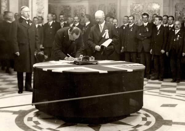 Sir Edward Carson  signing the Belfast City Hall, 1912