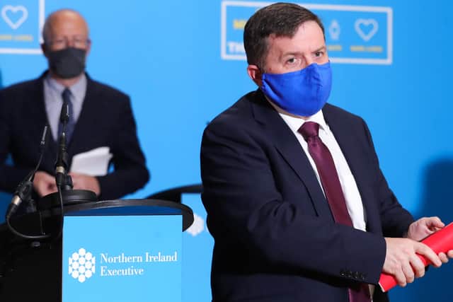 Health Minister Robin Swann and Chief Scientific Advisor Professor Ian Young (left) wore face masks to the press briefing at Stormont