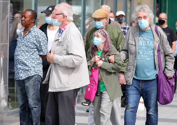 Shoppers pictured in Belfast city centre last week when face coverings became mandatory. Picture by Jonathan Porter/PressEye