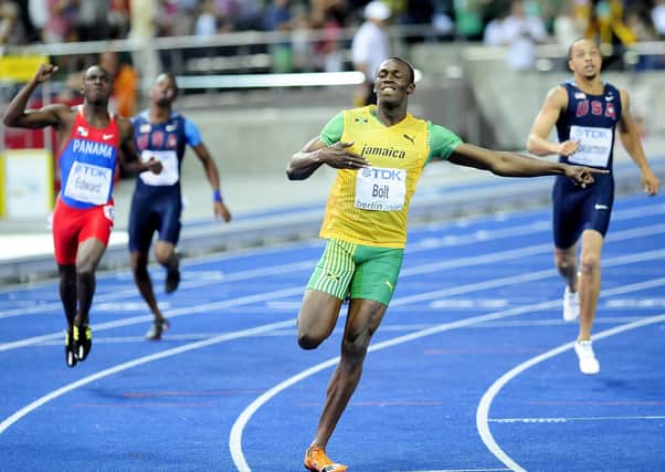 Jamaica's Usain Bolt sets a new World Record to win the Men's 200m Final during the IAAF World Championships at the Olympiastadion, Berlin.