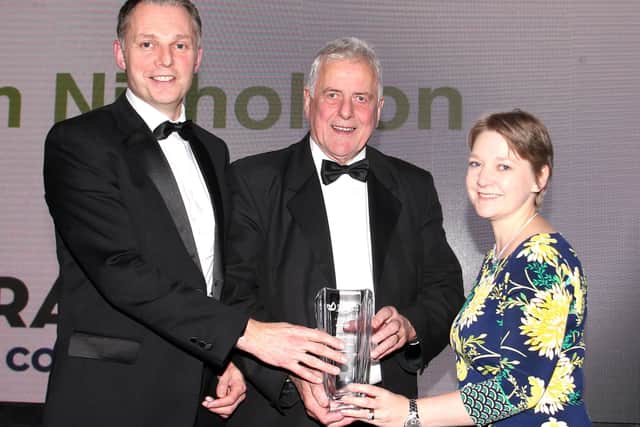 Jim Nicholson who was the recipient of last year's Lifetime Achievement award, pictured receiving his award from Martin Walsh, Site Financial
Controller of Cranswick, and Ruth Rodgers, editor Farming Life