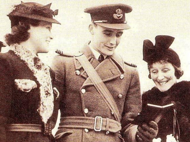 Buckingham Palace. March 1941. Anthony Lovell with mother and sister after receiving his first Distinguished Flying Cross from King George VI.