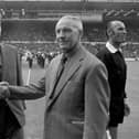 Leeds United manager Brian Clough (left) shakes hands with Liverpool manager Bill Shankly before the kick-off in 1974.