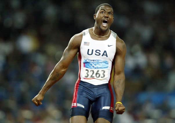United States' Justin Gatlin celebrates winning the men's 100metres final at the Olympic Stadium during the 2004 Olympic Games in Athens.