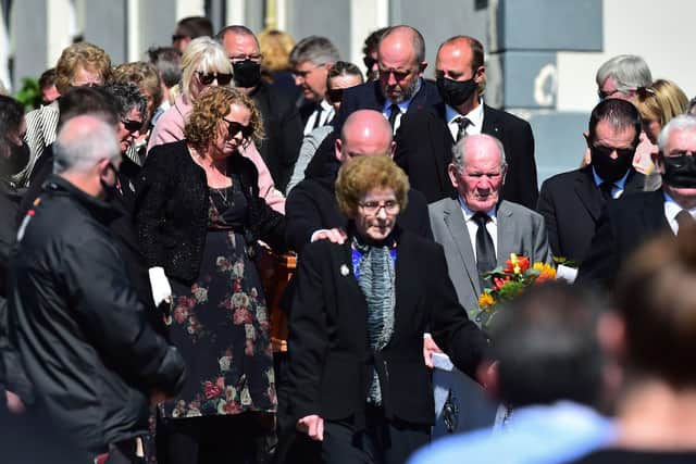Geraldine Mullan, with other mourners, at the funeral of John, Tomas and Amelia Mullan at St Pius X Parish Church in Moville. 
Pic Colm Lenaghan/Pacemaker.