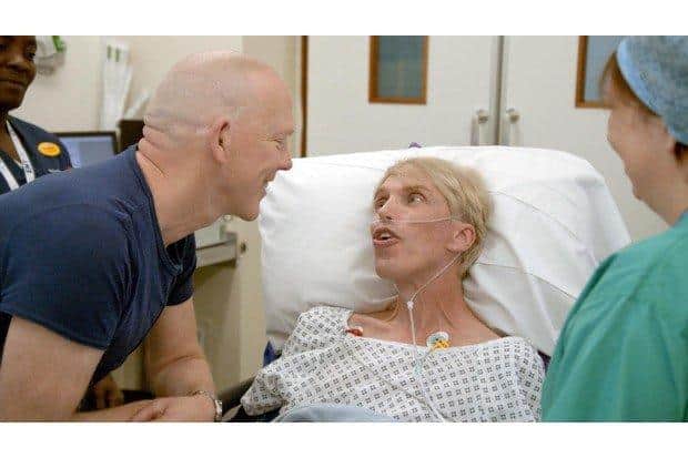 Peter with his partner pictured after undergoing a series of complex and risky operations