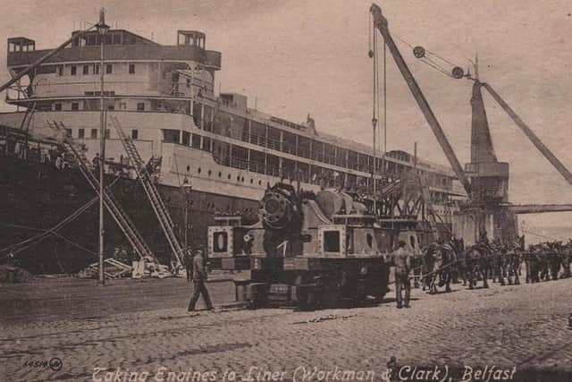 1918 postcard shows horses pulling engines to a ship in the Workman Clark Yard