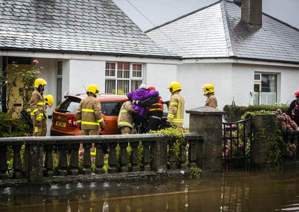 Firefighters assist with relief efforts during massive flood in Newcastle. Photo: Conor Kinahan/PACEMAKER PRESS