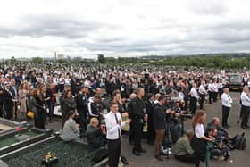 A crowd listens to former Sinn Fein president Gerry Adams speak during the funeral of senior Irish Republican and former leading IRA figure Bobby Storey at Milltown Cemetery in west Belfast. PA Photo. Picture date: Tuesday June 30, 2020. By Liam McBurney/PA Wire