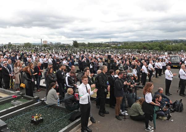 A crowd listens to former Sinn Fein president Gerry Adams speak during the funeral of senior Irish Republican and former leading IRA figure Bobby Storey at Milltown Cemetery in west Belfast. PA Photo. Picture date: Tuesday June 30, 2020. By Liam McBurney/PA Wire