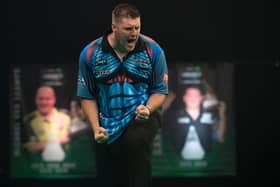 Daryl Gurney celebrates his win over Nathan Aspinall. PICTURE: Lawrence Lustig/PDC