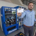Jason Halberg, Fastenal’s District Manager, demonstrates the contactless vending technology