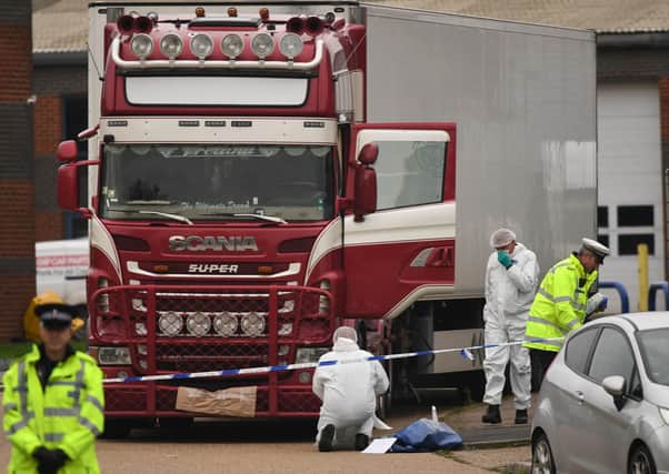 Police and forensic officers at the Waterglade Industrial Park in Grays, Essex, after 39 bodies of Vietnamese migrants were found in October last year