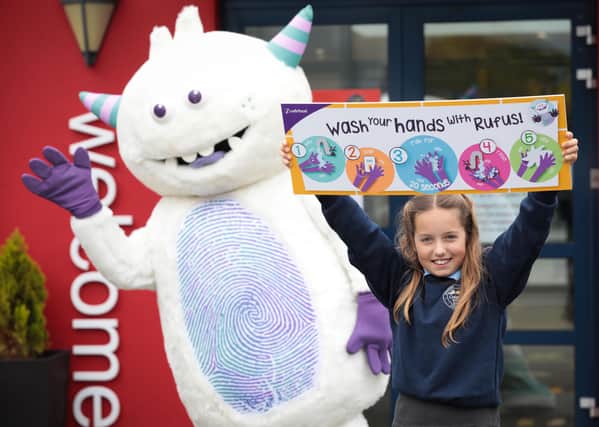 Launching the handwashing resource is Rufus the Handwashing Hero and Olivia Dorree from Cregagh Primary School in Belfast