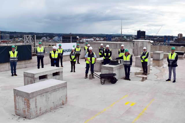 GRAHAM representatives from the privately-owned contractor gathered with senior management from developers, Valeo Group, to celebrate the installation of the highest fixing of the project