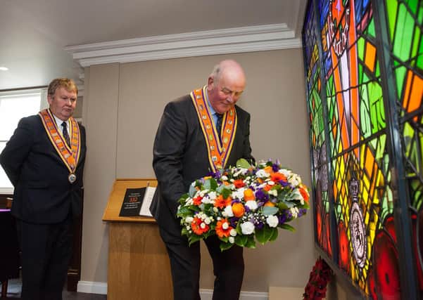 Grand Master Edward Stevenson lays a wreath at the Memorial Window in Schomberg House to mark Orange Victims’ Day. Picture: Graham Baalham-Curry