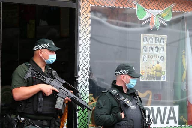 Police officers carry out searches last month as part of Operation Arbacia