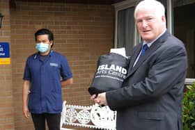 Alderman Michael Henderson MBE, Chairman of Leisure & Community Development Committee, Lisburn & Castlereagh City Council delivering Island Arts' 'Painting by Numbers Kits' to residents and staff at Beechill Care Home
