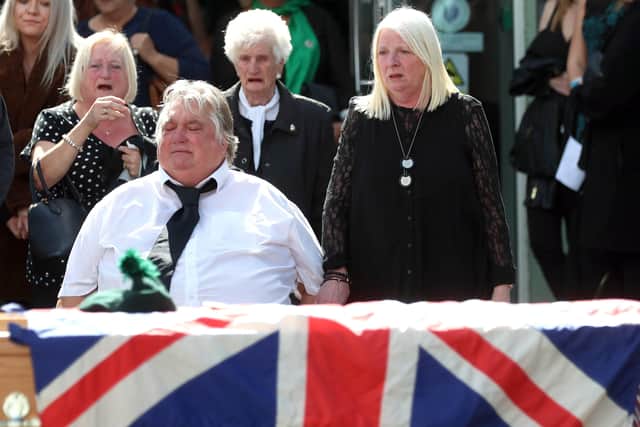 The parents of Brett Savage, Noel and Dolores, at their son's coffin during his funeral in Newtownards today. The 32-year-old former Royal Irish Regiment soldier took his life  after suffering from PTSD following service in Afghanistan. 
Photo: Stephen Davison, Pacemaker.