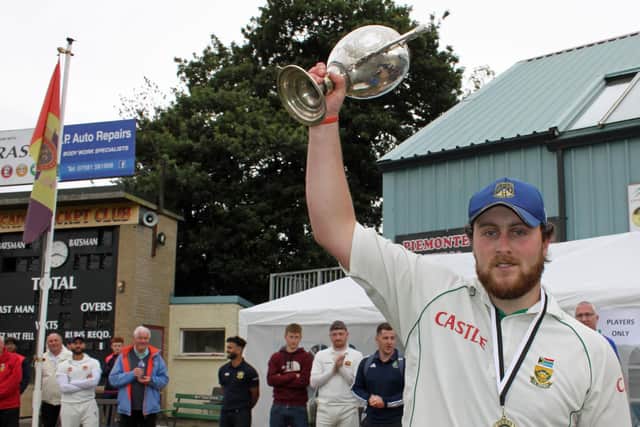 Donemana captain Wiliam McClintock lifts the NW Senior trophy aloft. Picture by Barry Chambers