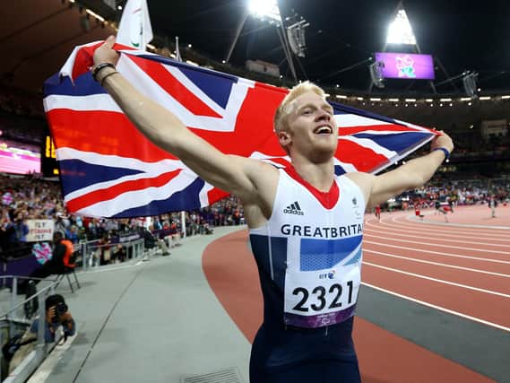 Great Britain's Jonnie Peacock celebrates as he crosses the line to win the Men's 100m - T44 Fina