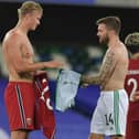 Stuart Dallas swaps shirt with Erling Haaland following their Nations League meeting.