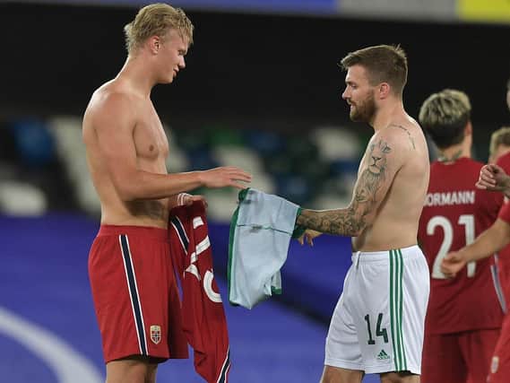 Stuart Dallas swaps shirt with Erling Haaland following their Nations League meeting.