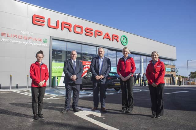 David Miskimmin (second left), Eurospar Millisle Area Manager and Gregory Cochrane Henderson Retail Store Project Manager (centre) are pictured with  Eurospar Millisle store manager, Joanne Knox (second right) and store staff at the official opening of the £3m community supermarket