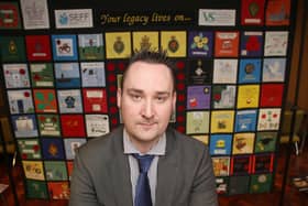Kenny Donaldson of South East Fermanagh Foundation, which supports victims of terrorism. He is seen at St Marys College, West Belfast in 2015 in front of a quilt made by family members from Fermanagh that lost loved ones in the Troubles. 
Picture Colm O'Reilly Press Eye
