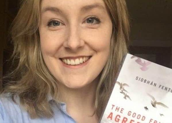 Siobhán Fenton pictured holding a copy of the book she authored, 'The Good Friday Agreement'. (Photo: Siobhán Fenton/Twitter)