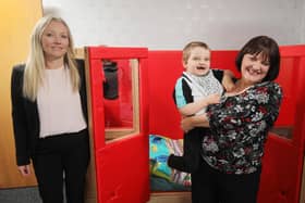 John Luke Faulkner with his mum Lisa and Kirsty Mairs (l), Partner/Head of Hospitality from the Belfast office of DWF.