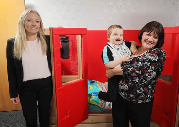 John Luke Faulkner with his mum Lisa and Kirsty Mairs (l), Partner/Head of Hospitality from the Belfast office of DWF.