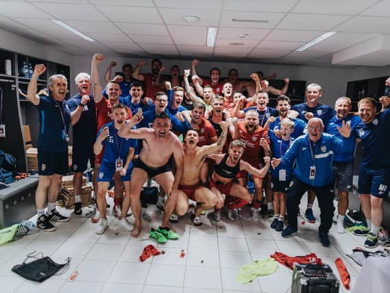 Coleraine players celebrate their win over NK Maribor. PICTURE: David Cavan