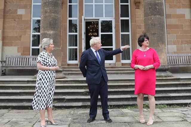 Deputy First Minister Michelle O'Neill, Prime Minister Boris Johnson and First Minister Arlene Foster at Hillsborough Castle in Northern Ireland during the Prime Minister's recent visit to Belfast.