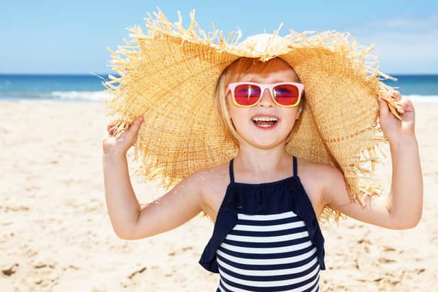 Sunhat, sunglasses and sun cream - a vital part of summer kit for your child