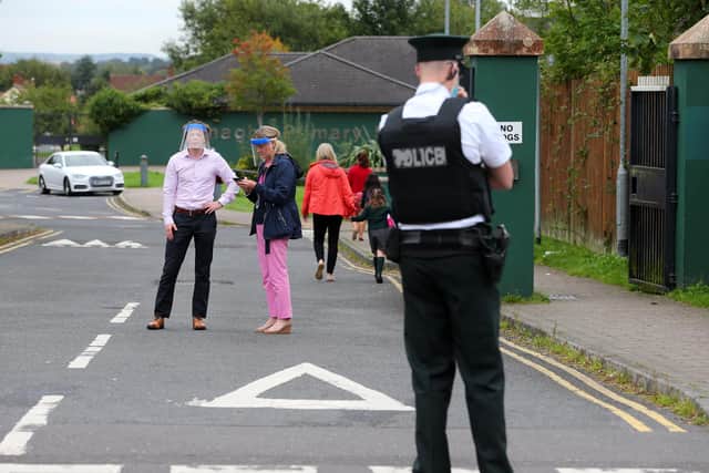 Staff at Finaghy Primary school Pacemaker - 
Police are in attendance at the scene of a security alert in the Finaghy Road South area of Belfast following the report of a suspicious device this morning.