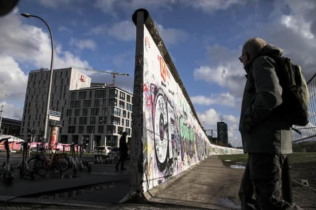 A surviving fragment of the Berlin wall, which separated east from west. Despite decades of communist rule and no participation in western capitalism areas of the old East Germany (although still quite poor) are catching up with the west of the nation