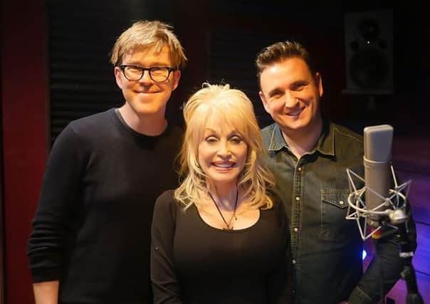 Belfast film composer Mark Gordon (left) and producer Colin Williams with Country music legend Dolly Parton in her recording studio in Dollywood