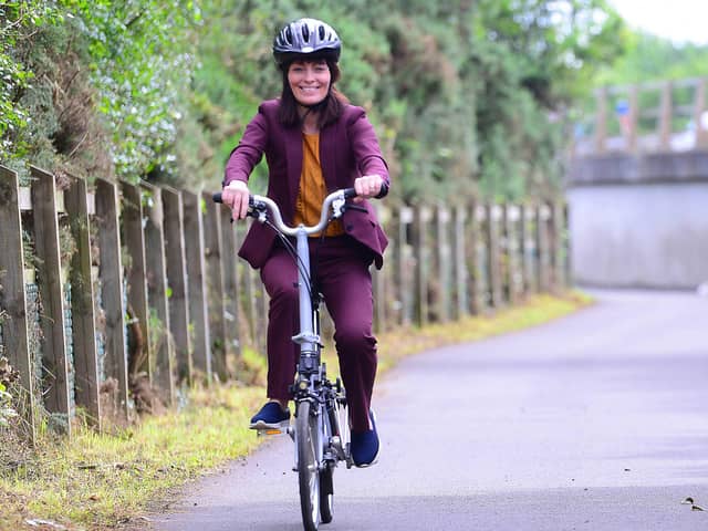Infrastructure Minister Nichola Mallon cycling on the Blaris Greenway in Lisburn