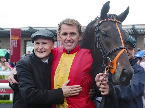 AP McCoy hugs Pat Smullen in the parade ring after Quizzical wins the Pat Smullen Champions Race For Cancer Trials Ireland during day two of the Longines Irish Champions Weekend at Curragh Racecourse in September 2019