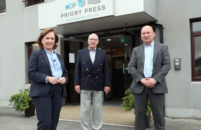 Pictured with Diane Dodds at Priory Press Packaging in Conlig are Ernest McConville, Chairman, Priory Press Packaging, and Mark McConville, Managing Director of the company