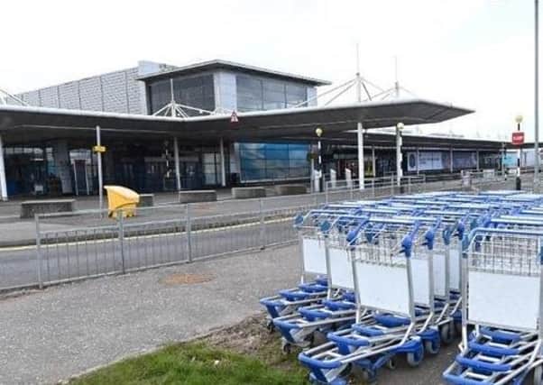 The decline in passengers at airports such as Belfast International, pictured, has put jobs in the wider aerospace industry at risk.