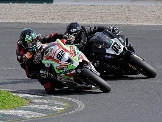 Derek Sheils leads Richie Ryan at the Dunlop Masters Series at Mondello Park in Co Kildare on Sunday. Picture: Pacemaker Press.